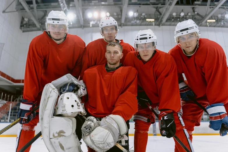 a team of hockey players pose for a po