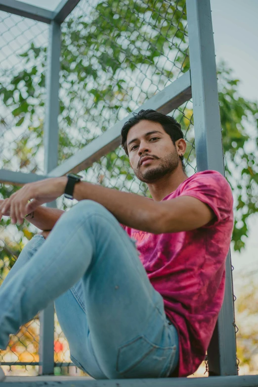 a young man poses for a po on the steps