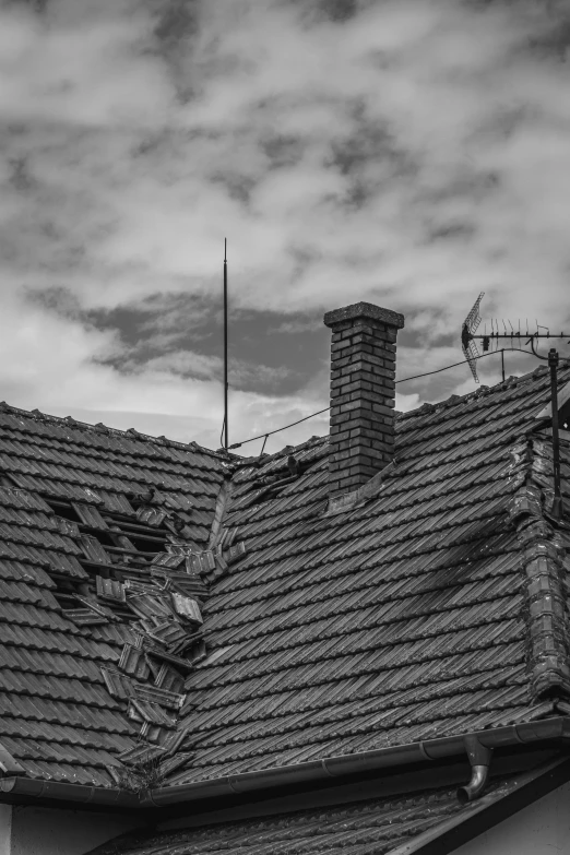 a black and white po of a building with a roof