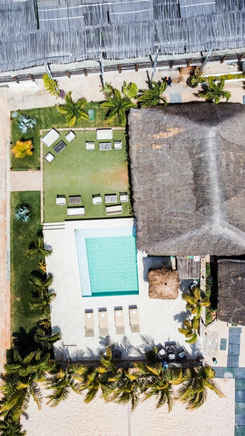 an aerial view of a home showing swimming pools