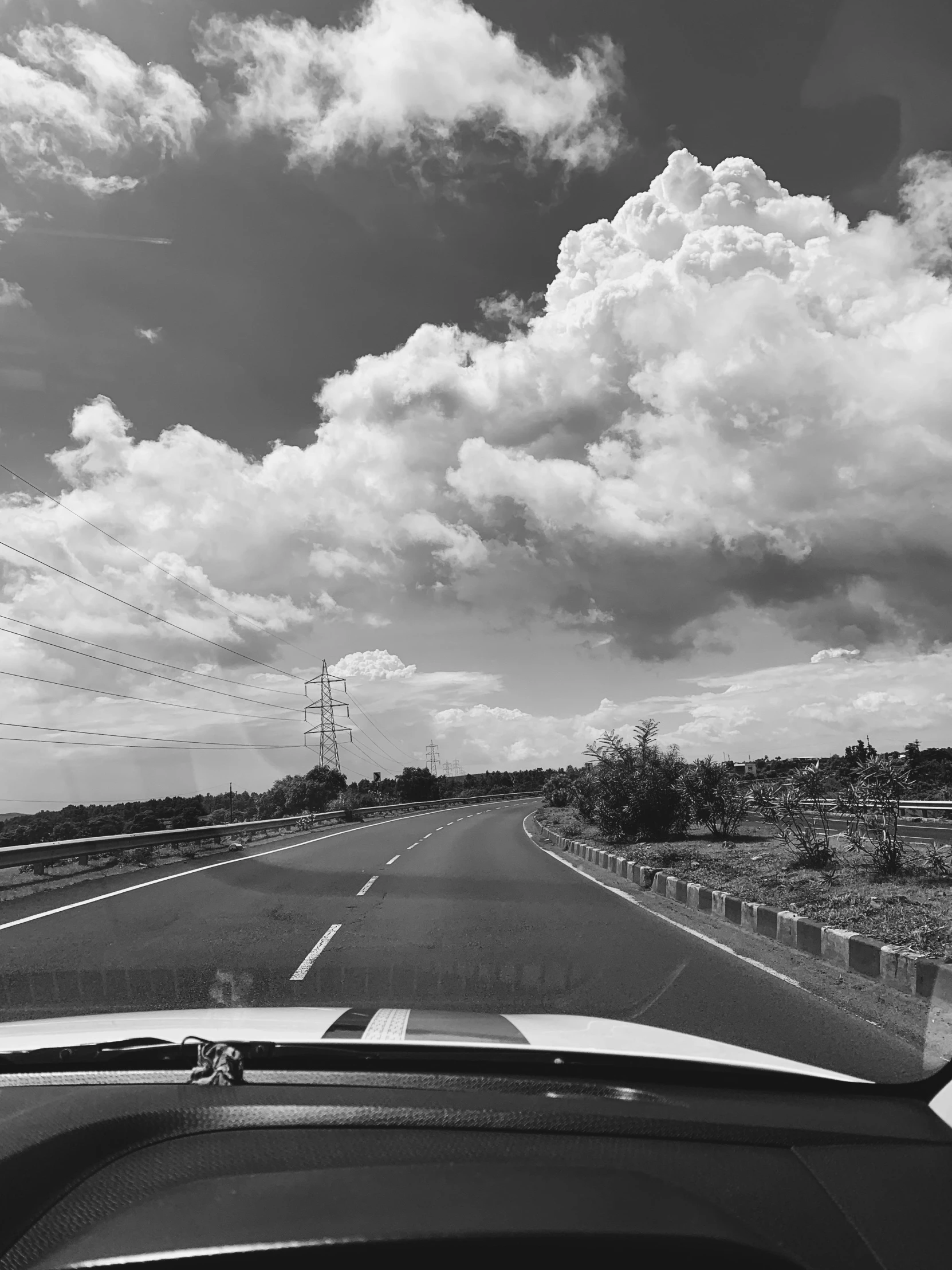 view from the passenger seat of the road through a windshield