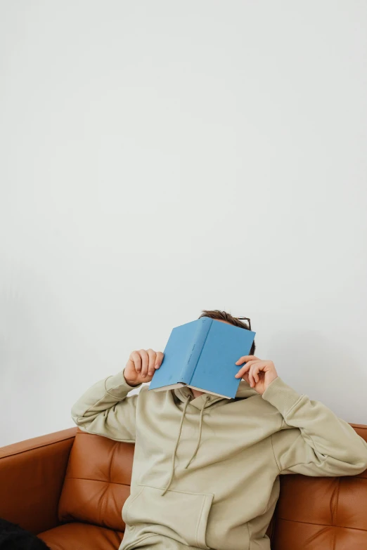 a person holding a book above their head