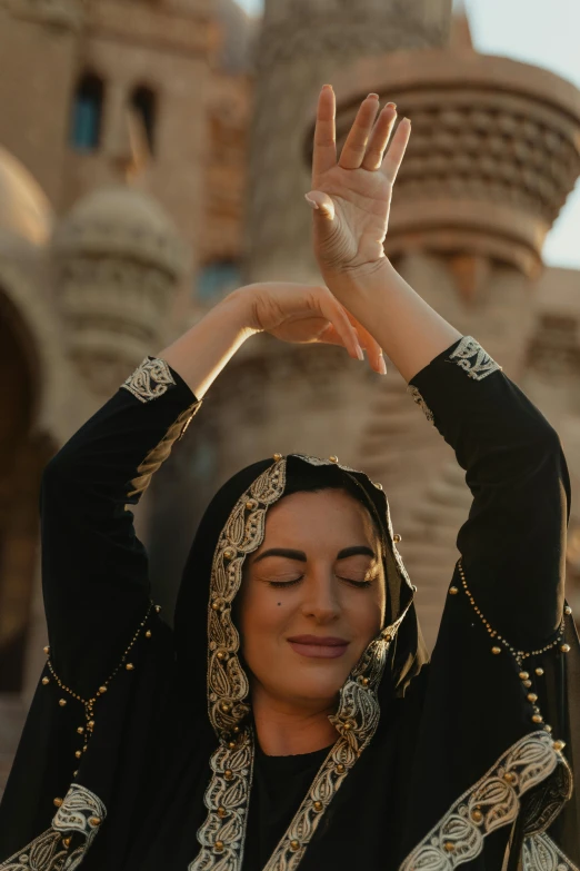 woman with black clothing is covering her hands