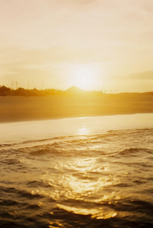 the sun rises on the water and reflects off the water