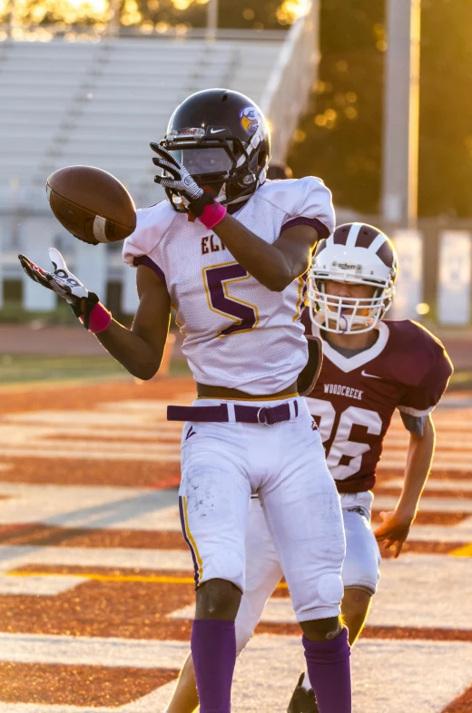 two football players are going for a play on the field