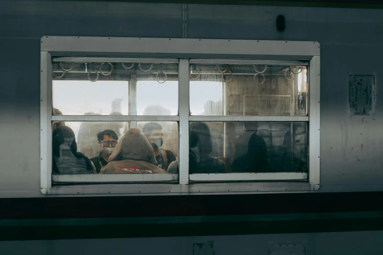 group of people hanging out a train window