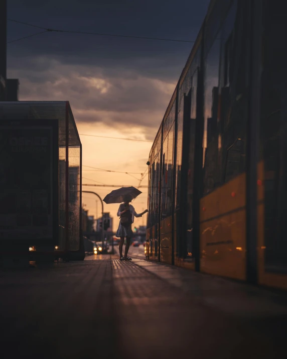 a woman is holding an umbrella as she walks away