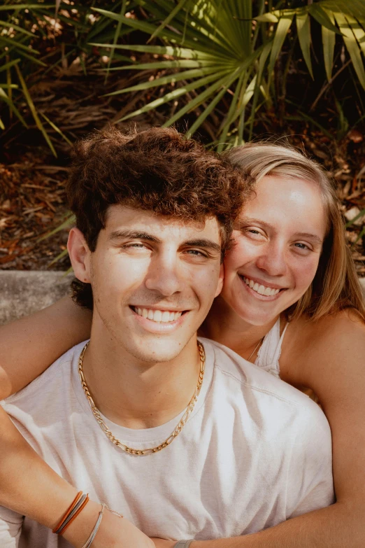 a young couple that is sitting together