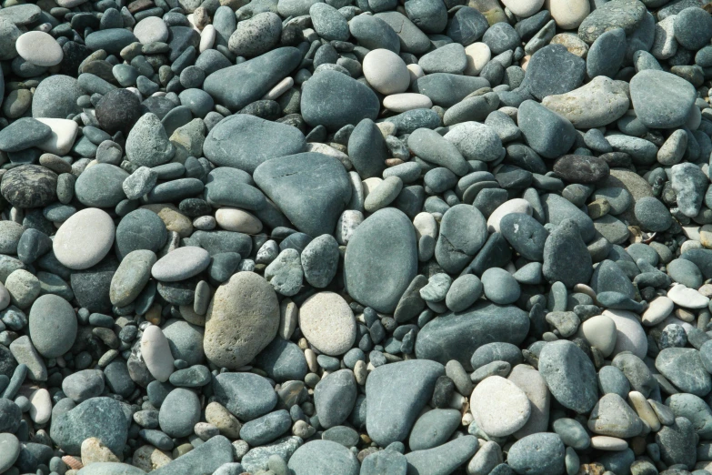a group of stones sits in a rocky field