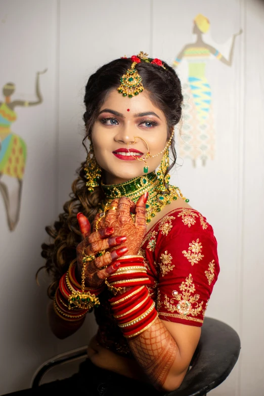 indian woman showing off her wedding jewelry