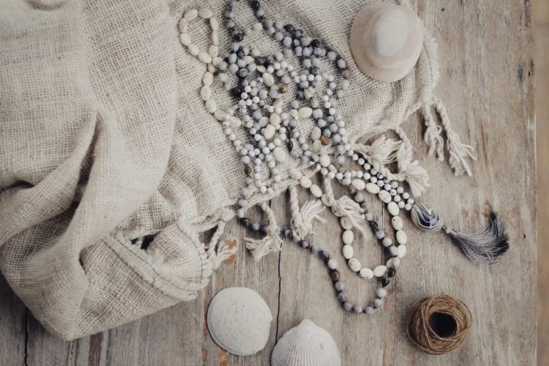 several different pieces of jewelry laying out on the floor