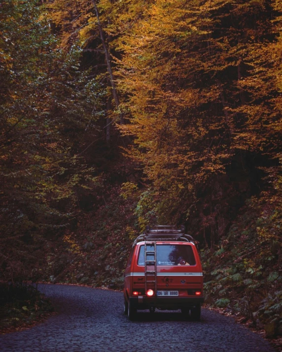 the truck is driving down the winding road