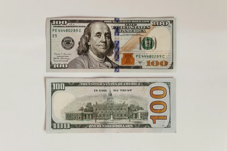 two twenty dollars bill next to each other