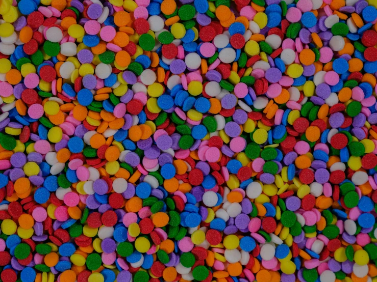 a bunch of colorfully colored confetti sprinkles