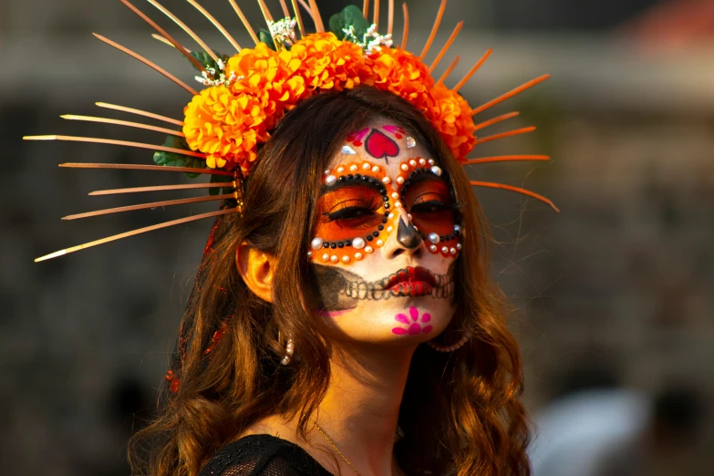 a woman in a face painted like an sunflower