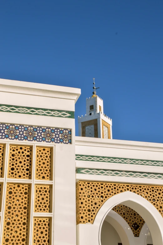 a tall building with two clocks mounted to the sides of it