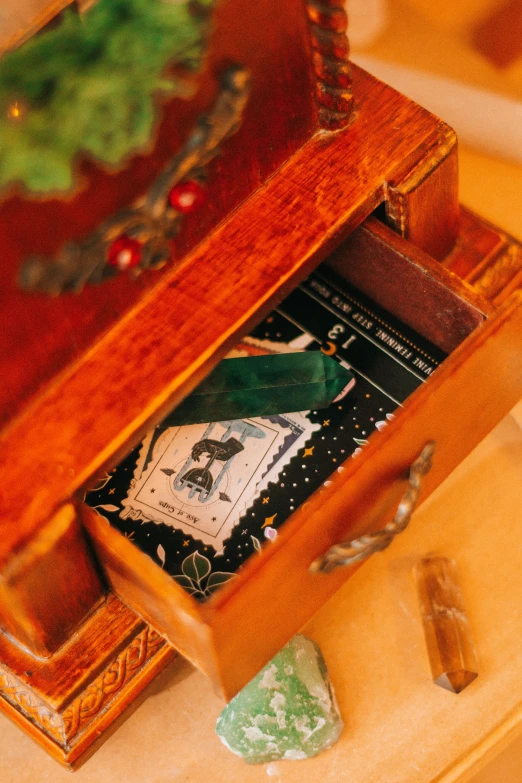 a chest and some objects laying around on the table