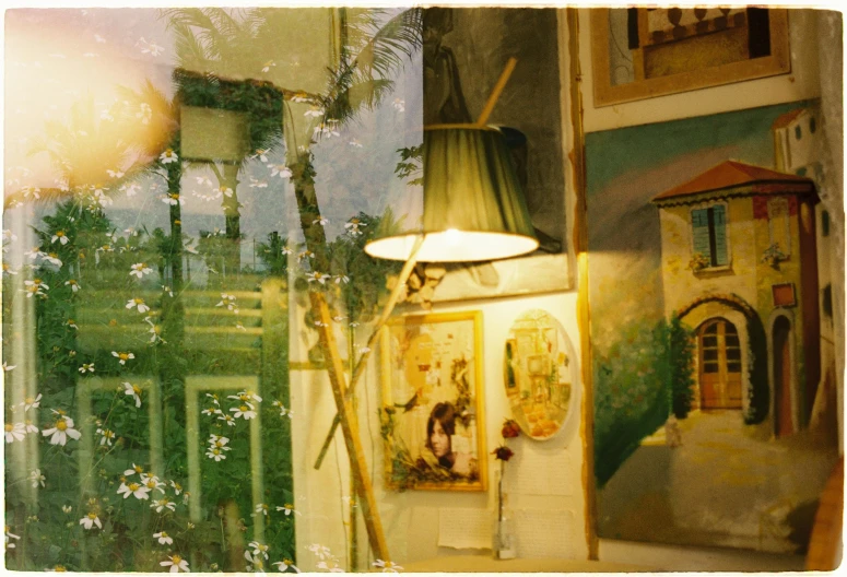 a small house has pictures and a lamp