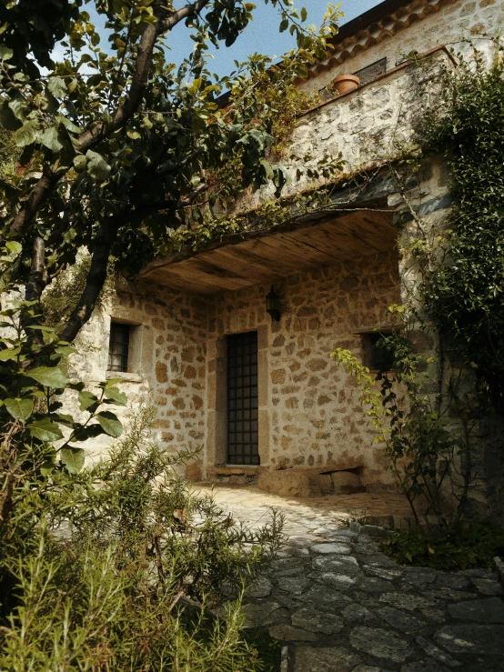 an old building with stairs and trees