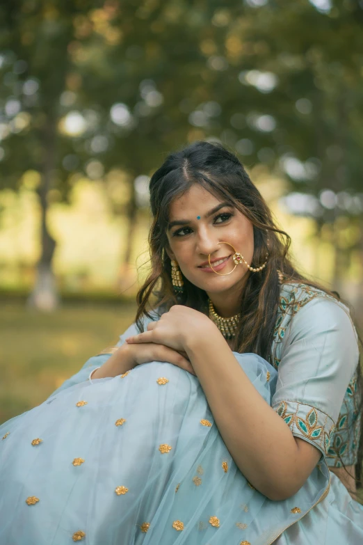 a woman in an indian outfit posing for a po