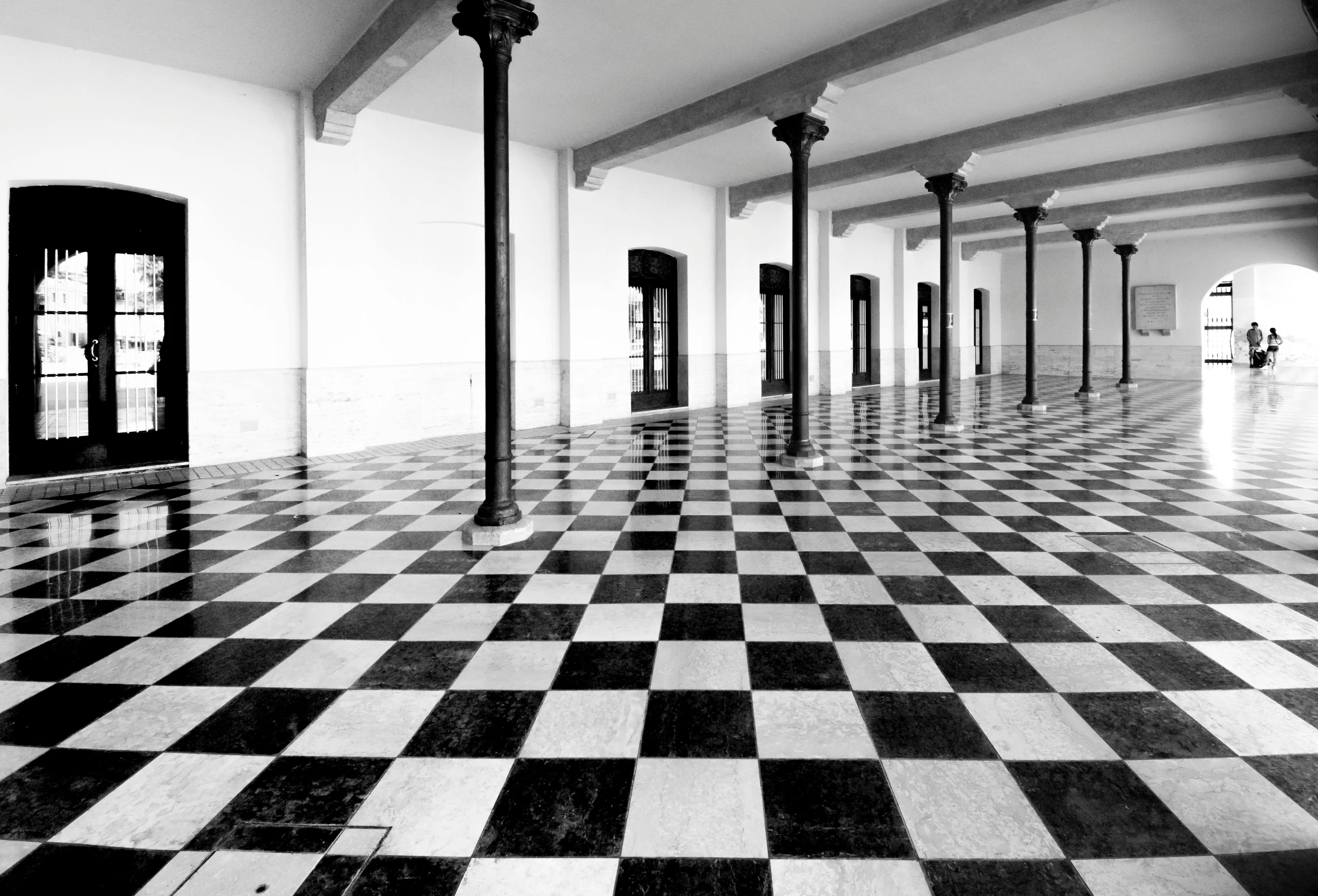 black and white pograph of an old building with checkered floor