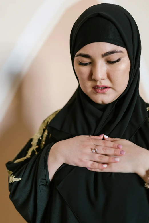 a beautiful young woman wearing black clothing