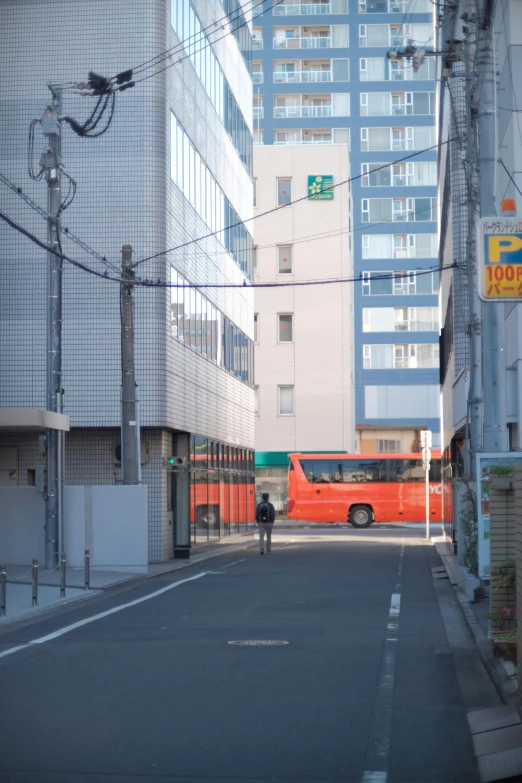 a man standing on the corner in a city street