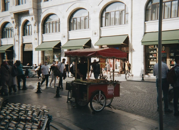 an image of a small cart driving on the street