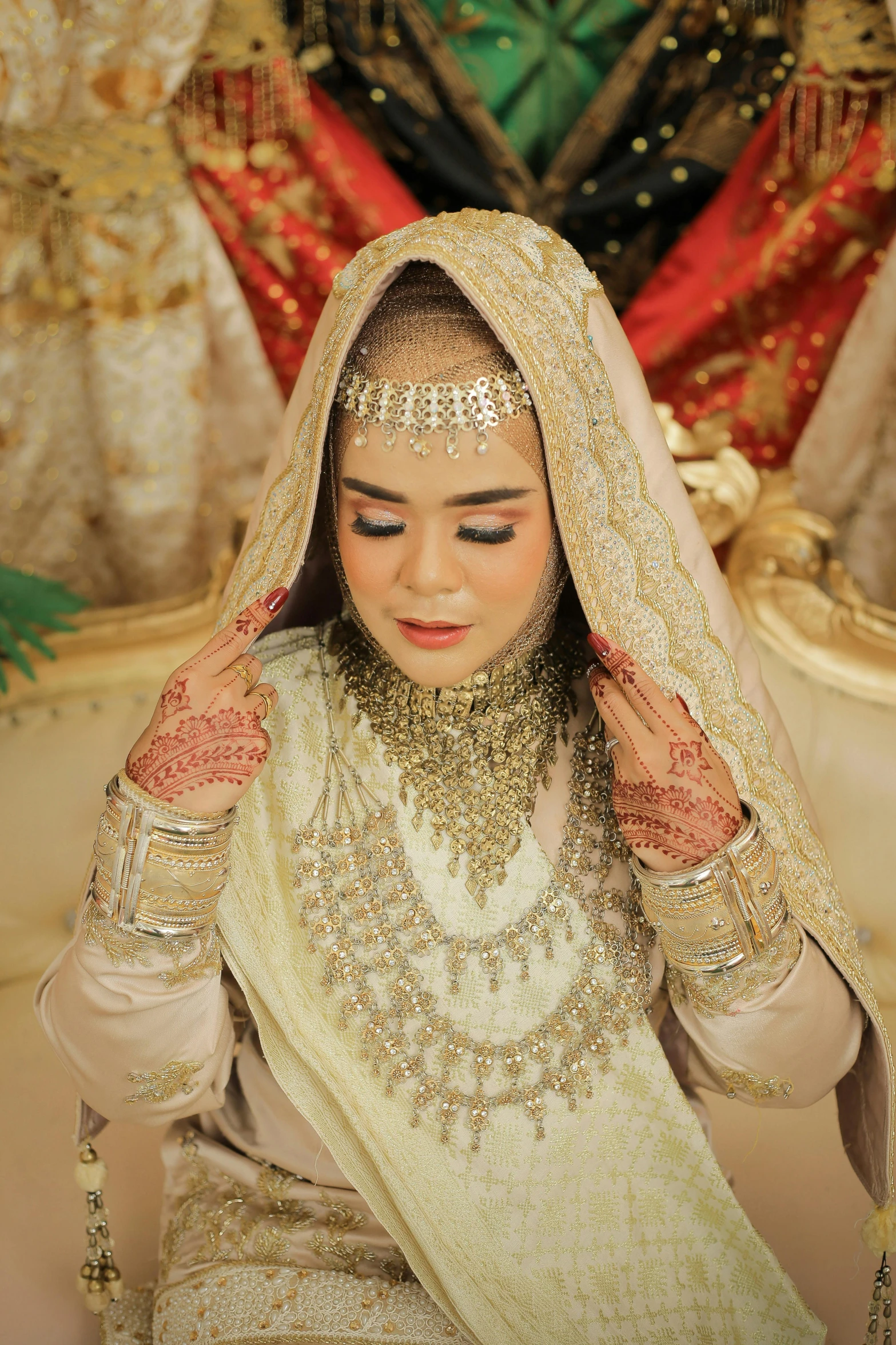 an indian bride in a golden and white bridal