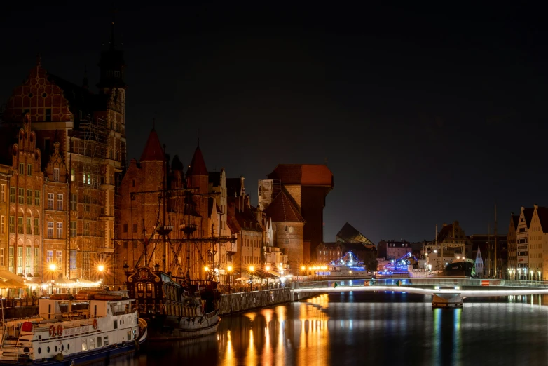 a view of a river at night in a city