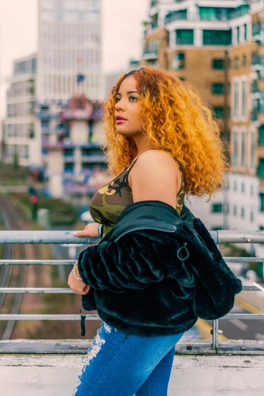 young woman with red hair wearing a green jacket