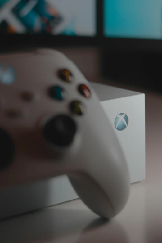 the front of a white controller is sitting on a table