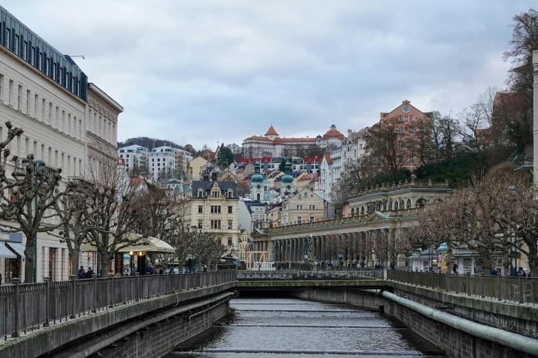 water running through a small river in the middle of a city