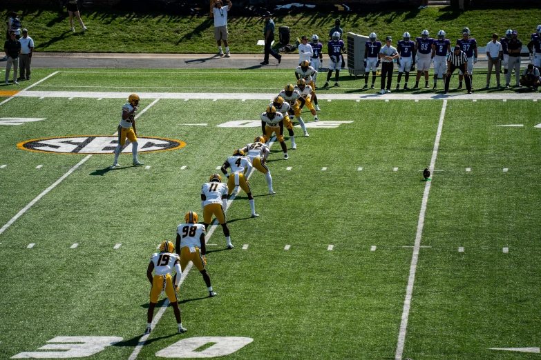 a football team standing on top of a field