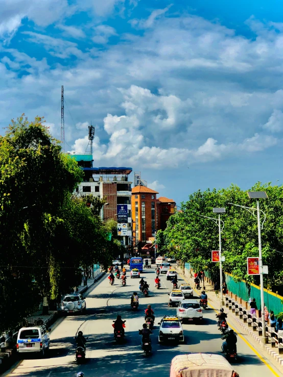 a number of cars traveling along a city street