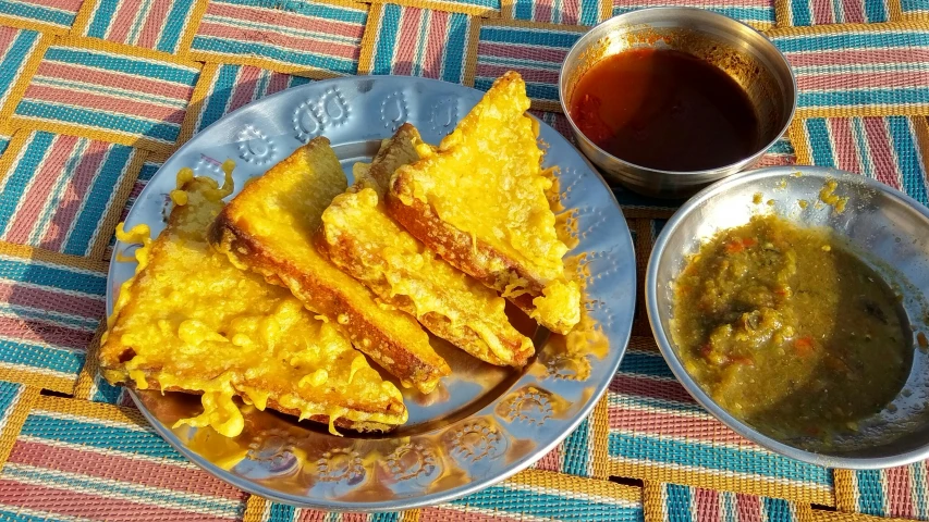 an omelette and some soup on a table