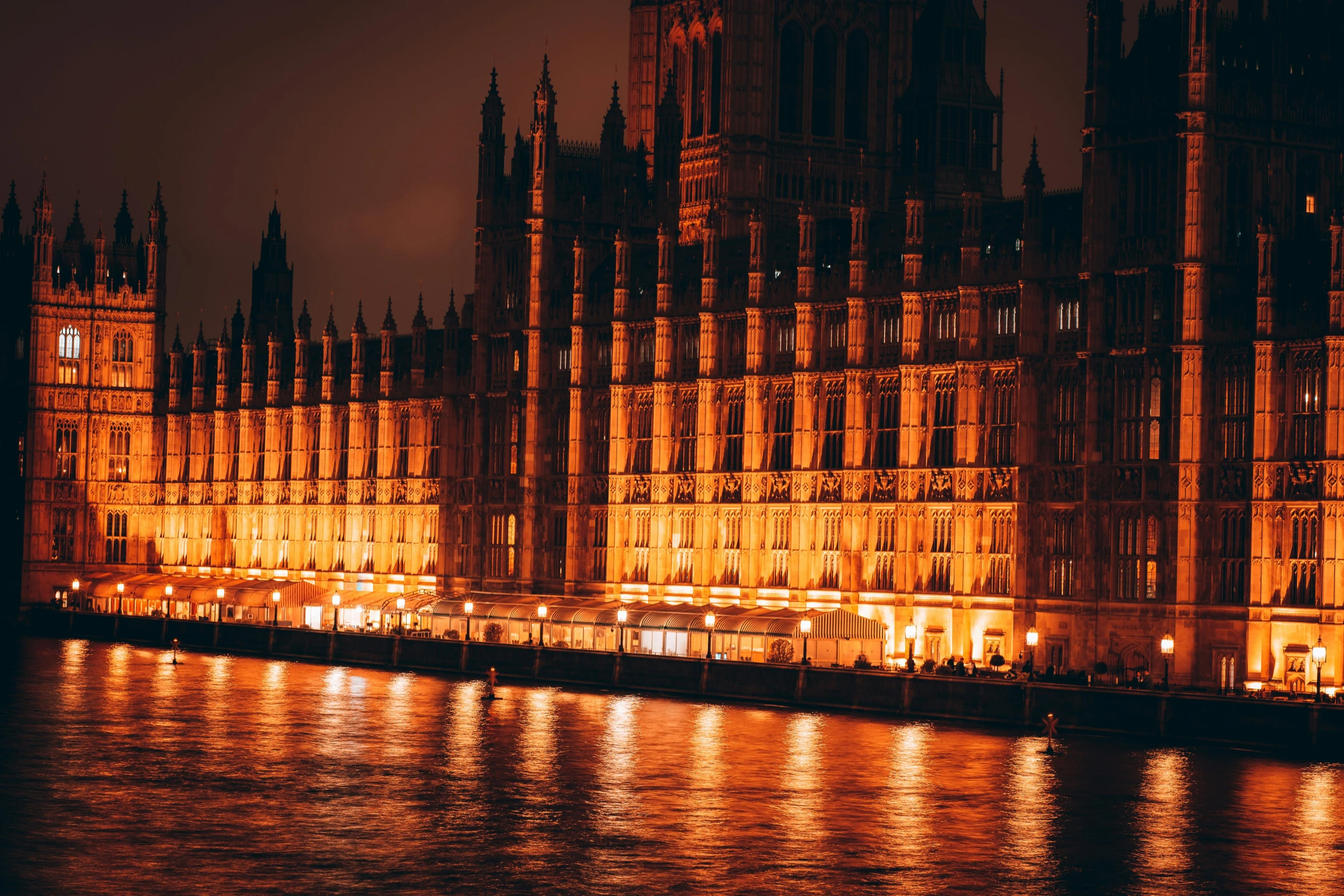 the buildings lit up by bright lights at night