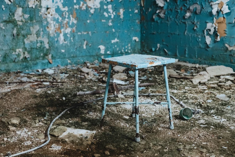 a table with an old paint chippings behind it