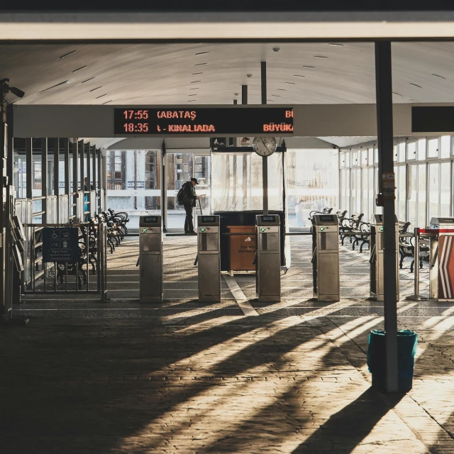 an airport lobby with lots of furniture and signs