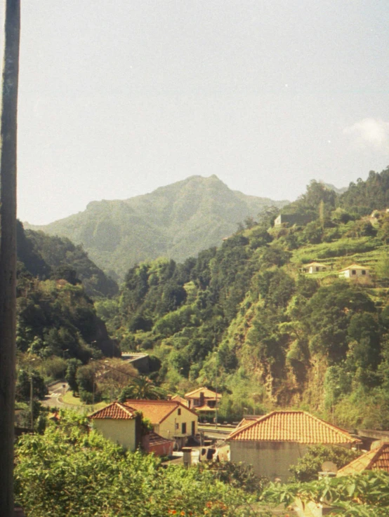 a town is shown with mountains in the background