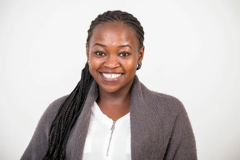 a woman in black jacket smiling for camera