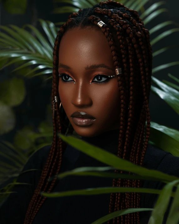 a woman with dreadlocks looking up at the camera