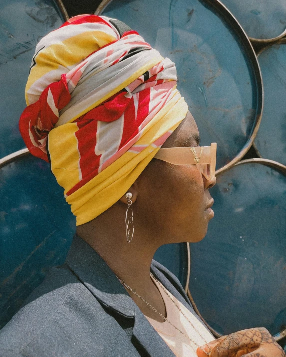 a woman with a bright bandanna on her head