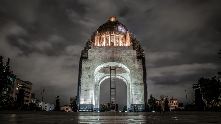 a very tall tower with an illuminated dome on top