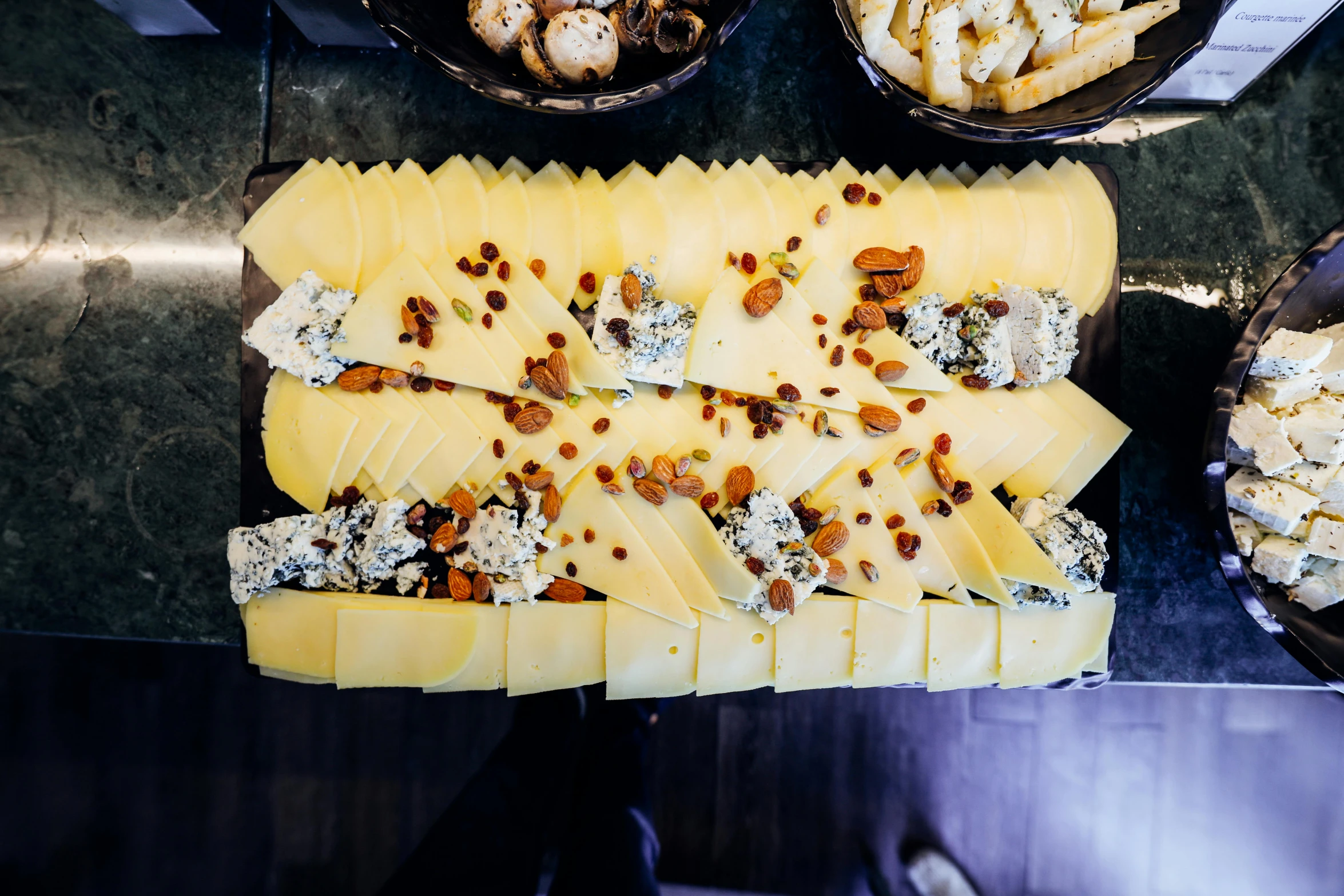 a plate of cheese and other food on a table