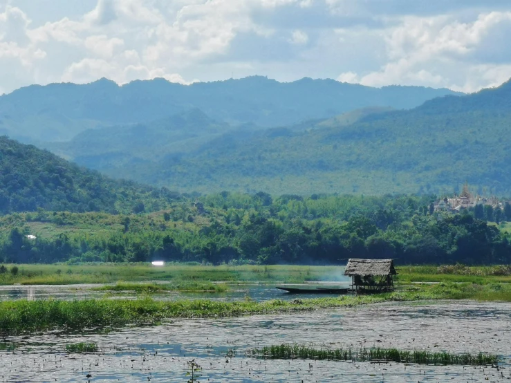 a lone bench sits in the middle of a river