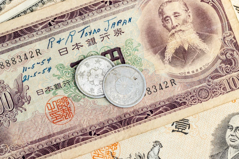 various japanese currency are arranged together in an array