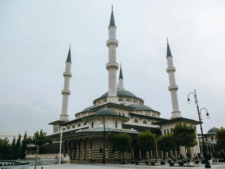 a large white building with two black spires