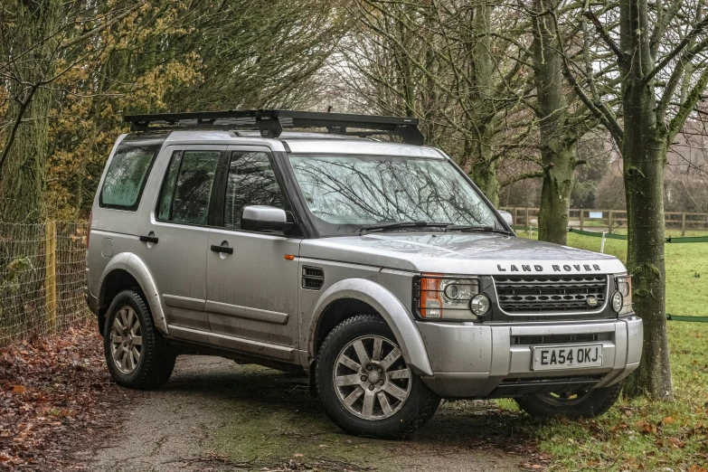 a land rover is parked on the side of the road