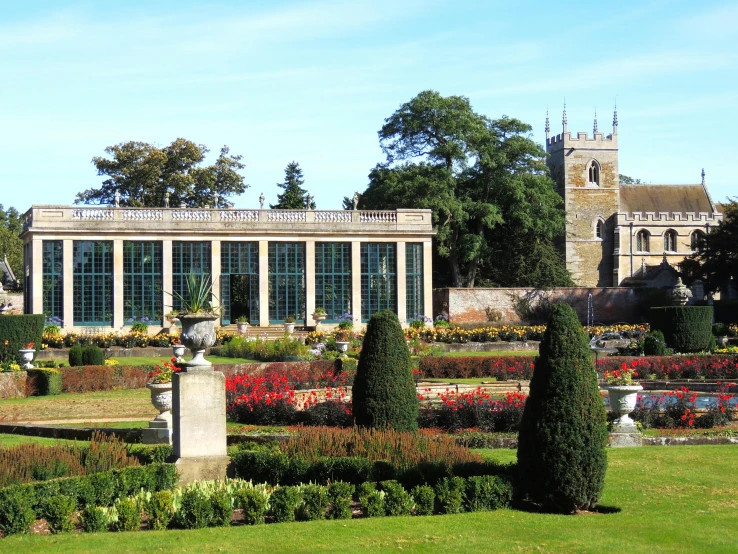 a large building in the middle of a garden